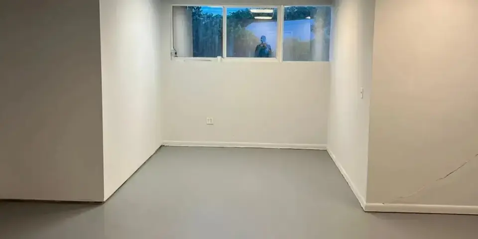 Commercial interior after ceiling tiles and gray floor installation in Miami