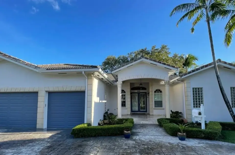 Now: Modern white and gray house exterior after painting in Miami