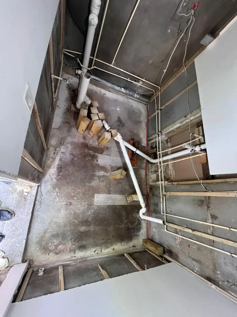 Before: Initial stage of new bathroom construction replacing laundry room in Miami