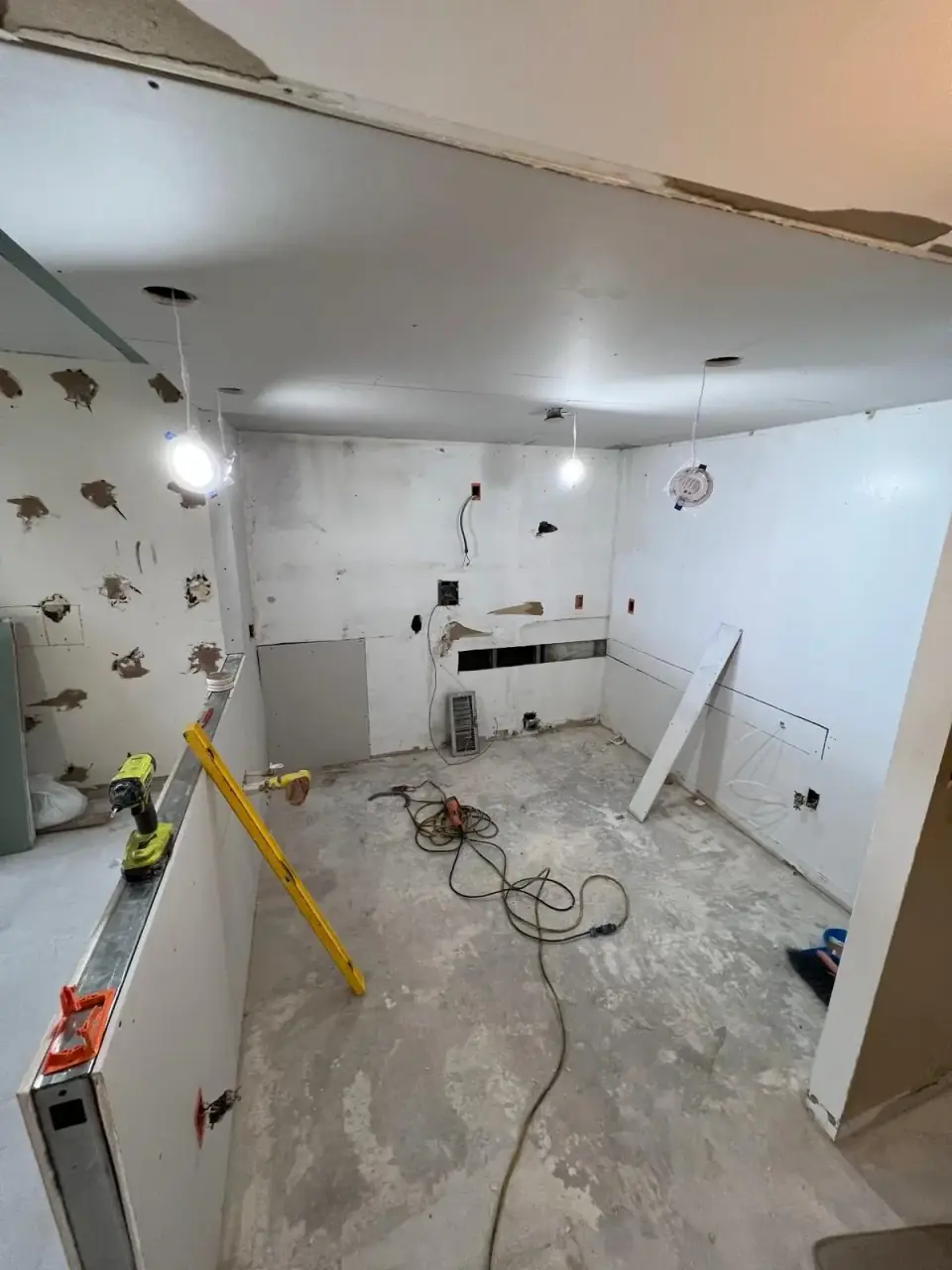 Before: Kitchen area before construction - side view in Miami apartment project