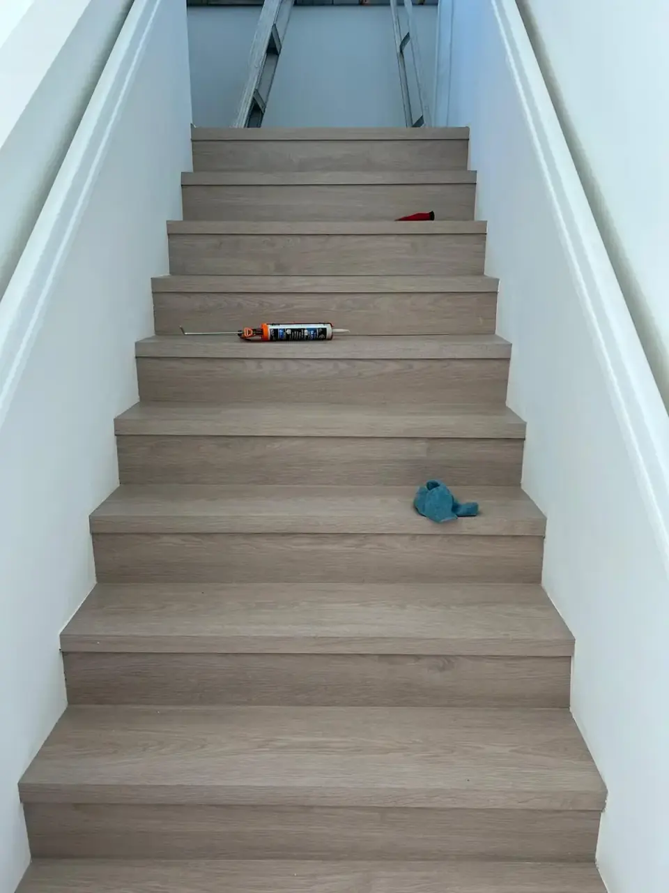 Now: Completed staircase with modern wood-look finish, Miami stairs renovation after installation