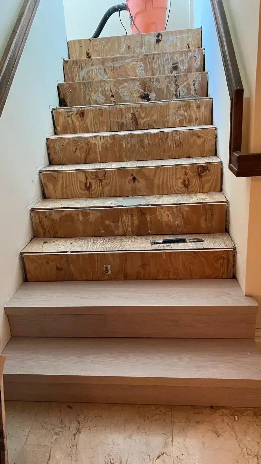 Before: Wooden stairs in early installation stage before flooring applied, Miami staircase renovation