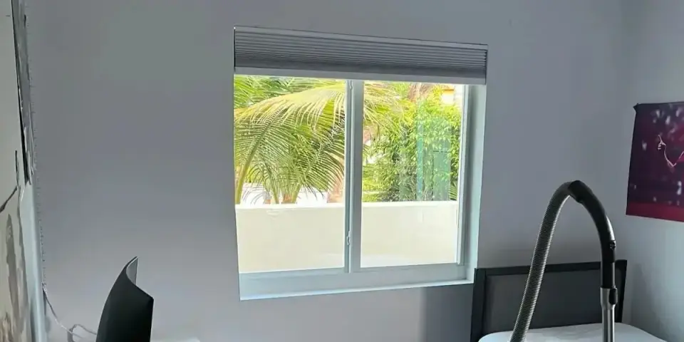 Modern sliding window fully installed in remodeled bedroom in Miami